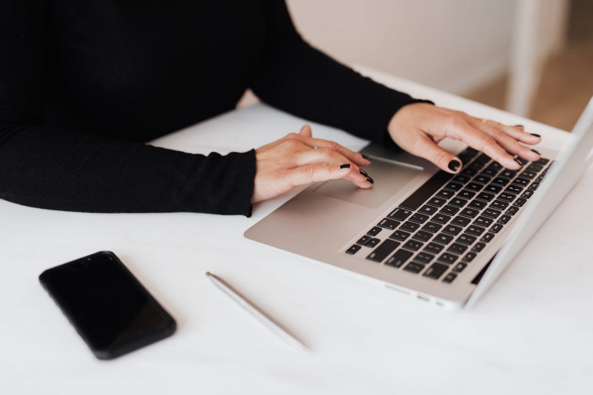 A woman is using a macboook