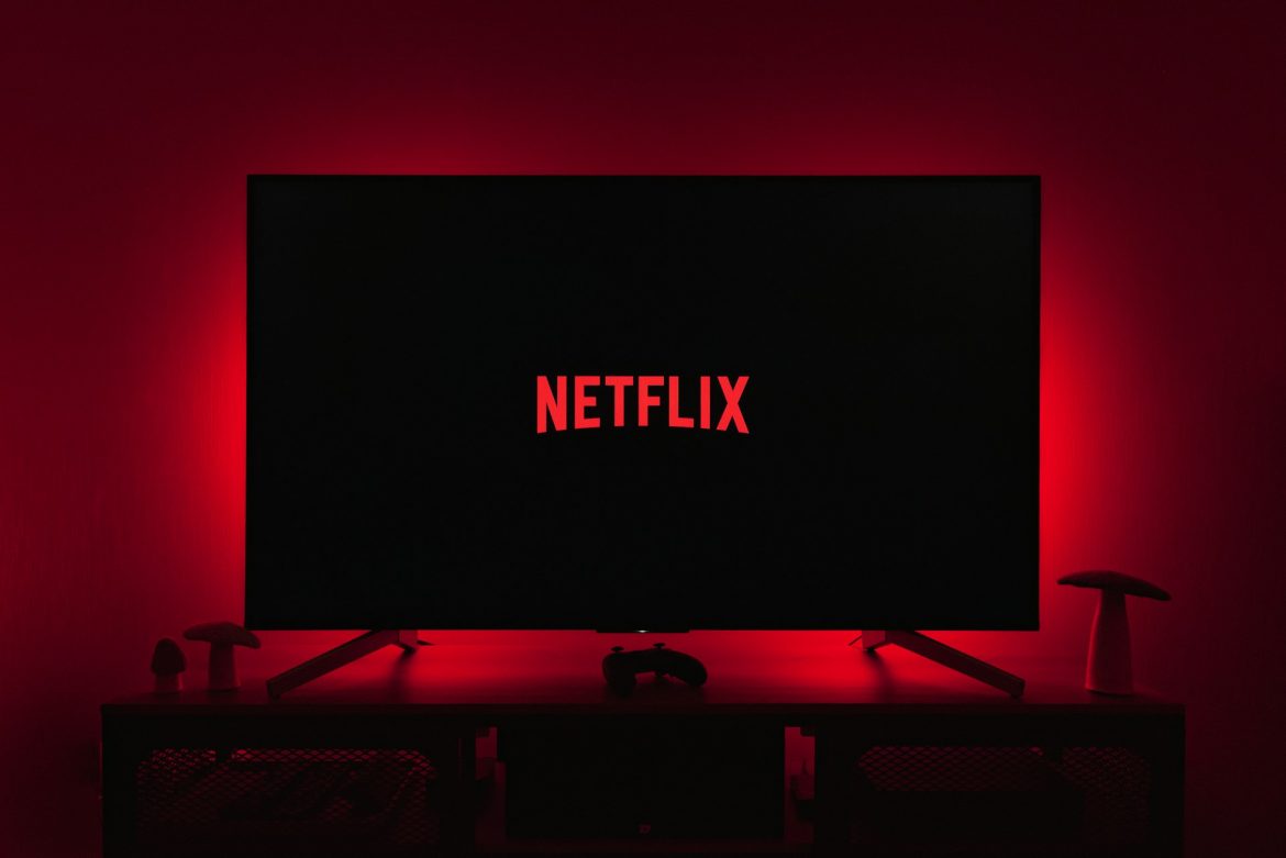 A TV playing one of the Streaming Services Netflix in a dark room